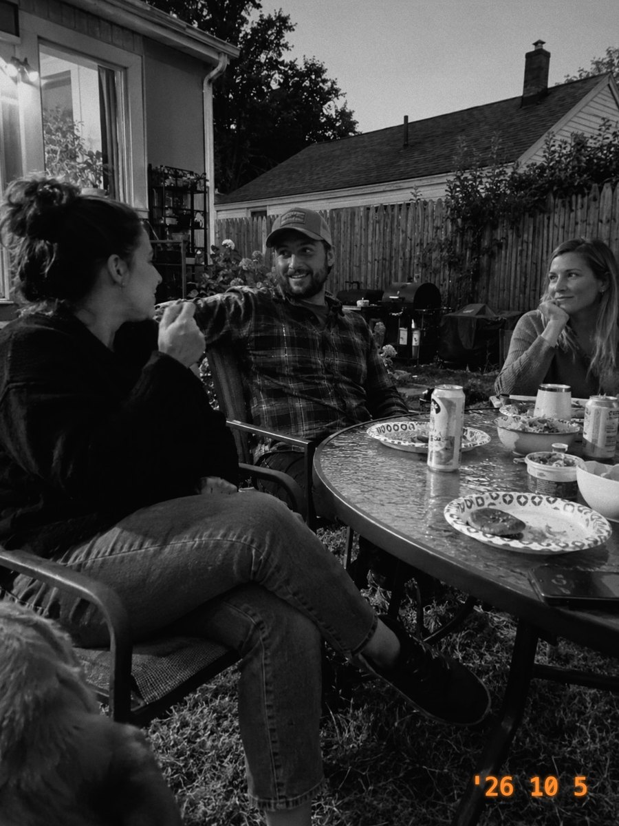 Three friends at a patio table at dusk, in Mono